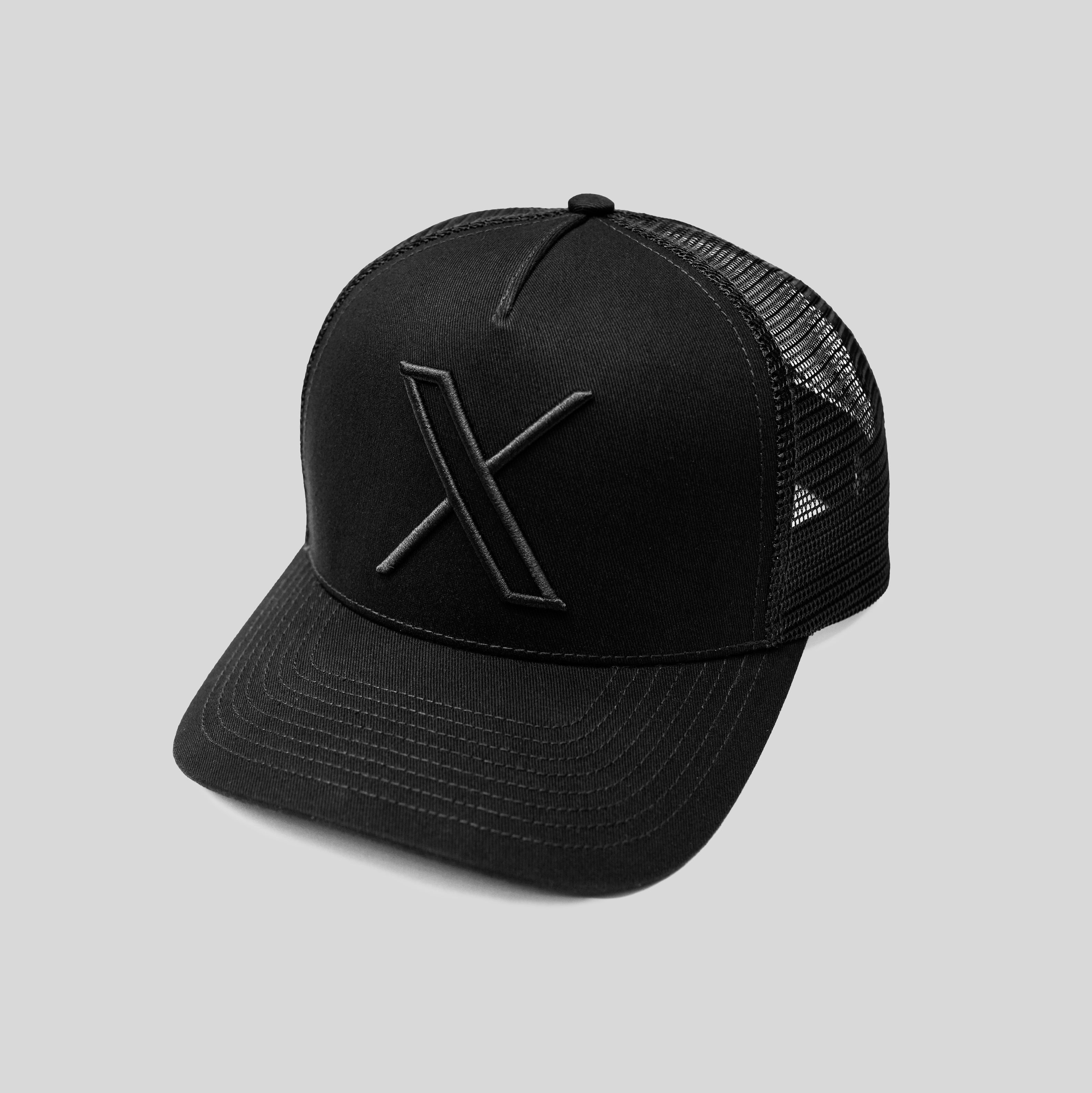 An image of the Unisex 3D Logo Trucker Hat showing the front and side of a black hat with a black embroidered X logo on the front and a black mesh back.